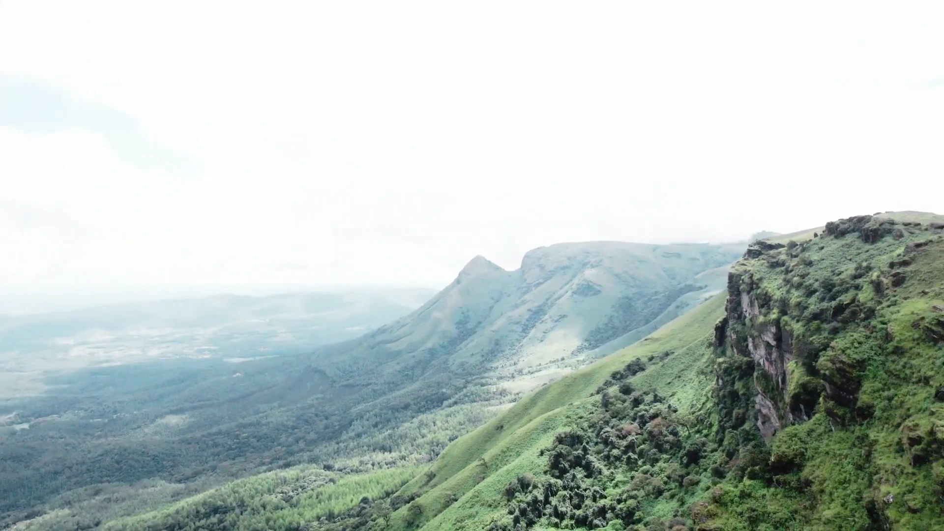 A green ridge opening onto the hills and valleys of Chikkamagaluru
